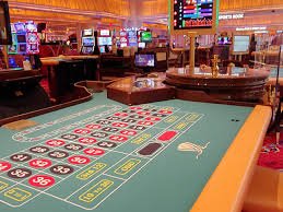 kasir77 mobile app interface showing live blackjack table and dashboard navigation